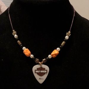 Handmade Harley-Davidson guitar pick necklace.